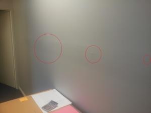 Effects of glancing light from a fluorescent light  on a plasterboard finish